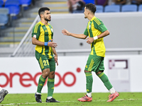 Ayoub Assal (R) of Al Wakrah SC celebrates after scoring a goal during the Ooredoo Qatar Stars League 24/25 match between Al-Wakrah SC and A...