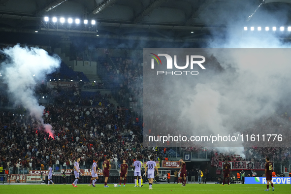 Athletic fans throw flares at Roma fans during the UEFA Europa League 2024/25 League Phase MD1 match between AS Roma and Athletic Club at St...