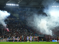 Athletic fans throw flares at Roma fans during the UEFA Europa League 2024/25 League Phase MD1 match between AS Roma and Athletic Club at St...