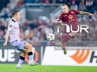 Angelino of AS Roma and Benat Prados of Athletic Club compete for the ball during the UEFA Europa League 2024/25 League Phase MD1 match betw...