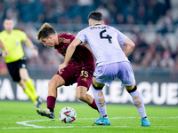 Tommaso Baldanzi of AS Roma and Aitor Paredes of Athletic Club compete for the ball during the UEFA Europa League 2024/25 League Phase MD1 m...