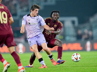 Unai Gomez of Athletic Club and Manu Kone' of AS Roma compete for the ball during the UEFA Europa League 2024/25 League Phase MD1 match betw...