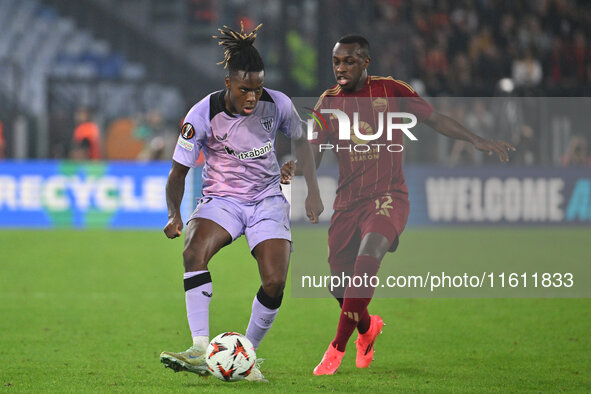 Nico Williams of Athletic Club de Bilbao and Saud Abdulhamid of A.S. Roma are in action during the UEFA Europa League 2024/25 League Phase M...