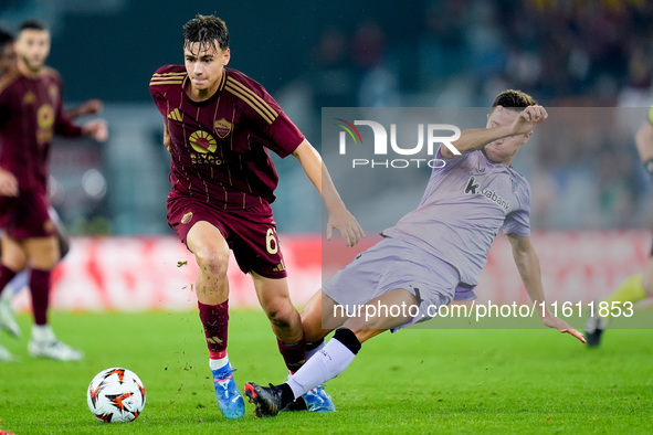 Ander Herrera of Athletic Club and Niccolo' Pisilli of AS Roma compete for the ball during the UEFA Europa League 2024/25 League Phase MD1 m...