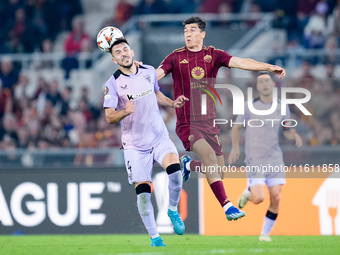 Aitor Paredes of Athletic Club and Eldor Shomurodov of AS Roma jump for the ball during the UEFA Europa League 2024/25 League Phase MD1 matc...