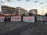 Demonstrators hold banners and flags outside the Israeli Embassy protesting against the Israeli strikes in Lebanon and the ongoing war in Ga...