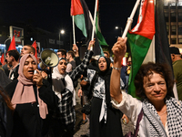 Demonstrators wave flags and chant slogans outside the Israeli Embassy protesting against the Israeli strikes in Lebanon and the ongoing war...