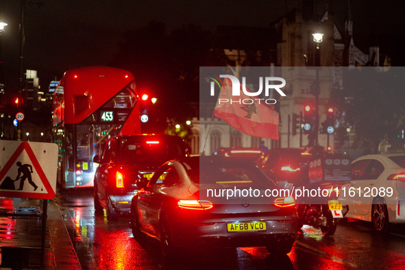 A Lebanese flag is placed on a car during a Lebanon Ceasefire Protest at 10 Downing Street in London, United Kingdom, on September 26, 2024....