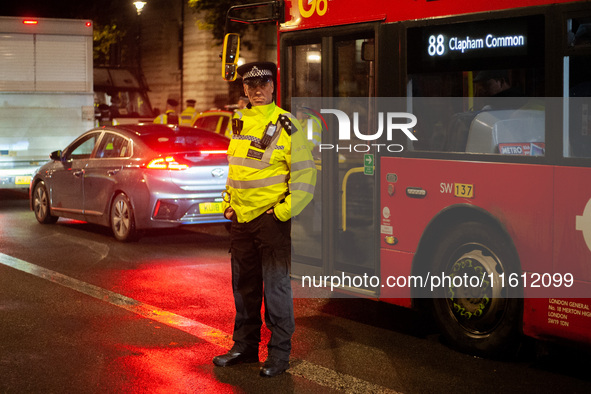 A police officer is on duty during the Lebanon Ceasefire Protest at 10 Downing Street in London, United Kingdom, on September 26, 2024. 