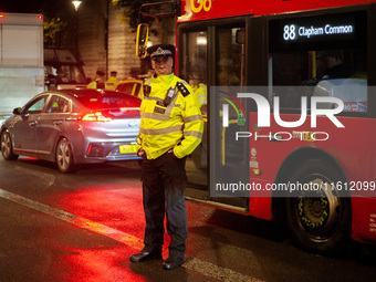 A police officer is on duty during the Lebanon Ceasefire Protest at 10 Downing Street in London, United Kingdom, on September 26, 2024. (