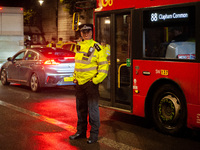 A police officer is on duty during the Lebanon Ceasefire Protest at 10 Downing Street in London, United Kingdom, on September 26, 2024. (