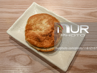 Shaanxi Chinese hamburgers are served at a night market in Nanning, China, on April 9, 2024. (