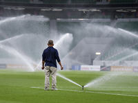 Sprinklers water the pitch inside Al Thumama Stadium before the Ooredoo Qatar Stars League 24/25 match between Al Rayyan SC and Al Arabi SC...