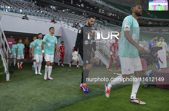 Al Rayyan SC and Al Arabi SC players walk onto the pitch before the Ooredoo Qatar Stars League 24/25 match between Al Rayyan SC and Al Arabi...