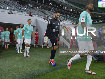 Al Rayyan SC and Al Arabi SC players walk onto the pitch before the Ooredoo Qatar Stars League 24/25 match between Al Rayyan SC and Al Arabi...