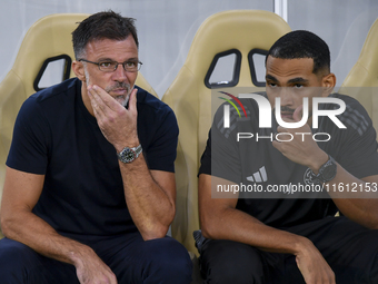 Anthony Patrick Hudson (L), head coach of Al Arabi SC, looks on before the Ooredoo Qatar Stars League 24/25 match between Al Rayyan SC and A...