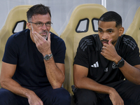 Anthony Patrick Hudson (L), head coach of Al Arabi SC, looks on before the Ooredoo Qatar Stars League 24/25 match between Al Rayyan SC and A...