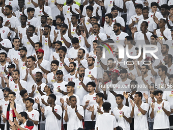 Fans of Al Rayyan SC cheer for the team during the Ooredoo Qatar Stars League 24/25 match between Al Rayyan SC and Al Arabi SC at Al Thumama...