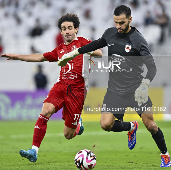 Sami Beldi (R) of Al Rayyan SC battles for the ball with Ahmed Alaaeildin Abdelmotaal (L) of Al Arabi SC during the Ooredoo Qatar Stars Leag...