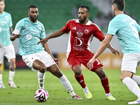 Abdel Aziz Hatim of Al Rayyan SC battles for the ball with Ahmed Fathi Abdoulla of Al Arabi SC during the Ooredoo Qatar Stars League 24/25 m...