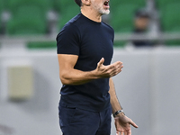 Anthony Patrick Hudson, head coach of Al Arabi SC, reacts during the Ooredoo Qatar Stars League 24/25 match between Al Rayyan SC and Al Arab...