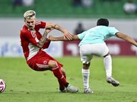 Ahmed Albakheet Al-Minhal (R) of Al Rayyan SC battles for the ball with Rodriguez Sanchez Rodrigo (L) of Al Arabi SC during the Ooredoo Qata...