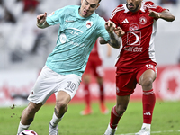 Roger Krug Guedes (L) of Al Rayyan SC battles for the ball with Jassem Gaber Abdulsallam (R) of Al Arabi SC during the Ooredoo Qatar Stars L...