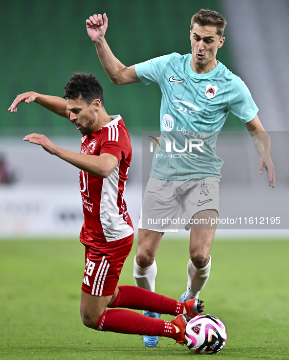 Julien De Sart (R) of Al Rayyan SC battles for the ball with Youssef Msakni (L) of Al Arabi SC during the Ooredoo Qatar Stars League 24/25 m...