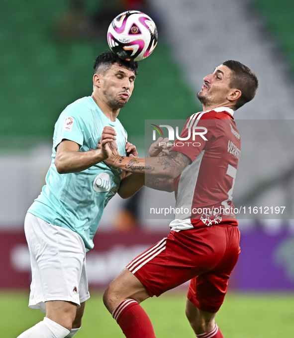 Murad Naji Hussein (L) of Al Rayyan SC battles for the ball with Marco Verratti (R) of Al Arabi SC during the Ooredoo Qatar Stars League 24/...