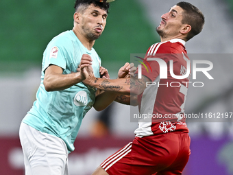 Murad Naji Hussein (L) of Al Rayyan SC battles for the ball with Marco Verratti (R) of Al Arabi SC during the Ooredoo Qatar Stars League 24/...