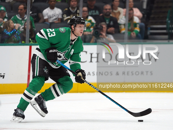 Esa Lindell #23 of the Dallas Stars skates up the ice while controlling the puck during the NHL preseason match between the Dallas Stars and...