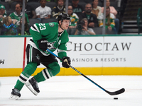 Esa Lindell #23 of the Dallas Stars skates up the ice while controlling the puck during the NHL preseason match between the Dallas Stars and...