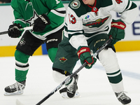 Hunter Haight #43 of Minnesota Wild skates with control of the puck while defended by Logan Stankoven #11 of Dallas Stars during the NHL pre...