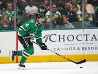 Miro Heiskanen #4 of the Dallas Stars skates up the ice while controlling the puck during the NHL preseason match between the Dallas Stars a...