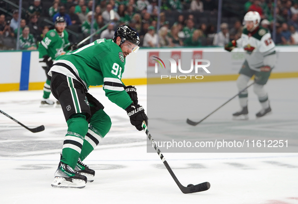 Tyler Seguin #81 of the Dallas Stars skates up the ice while controlling the puck during the NHL preseason match between the Dallas Stars an...