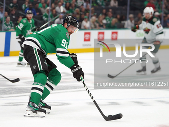 Tyler Seguin #81 of the Dallas Stars skates up the ice while controlling the puck during the NHL preseason match between the Dallas Stars an...