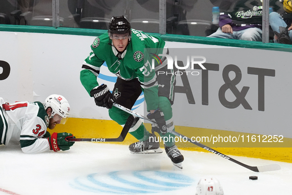 Mason Marchment #27 of the Dallas Stars skates up the ice while controlling the puck during the NHL preseason match between the Dallas Stars...