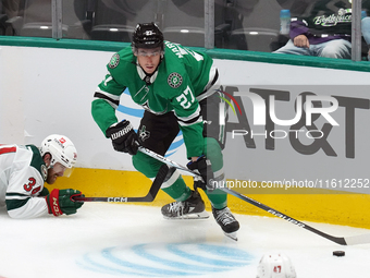 Mason Marchment #27 of the Dallas Stars skates up the ice while controlling the puck during the NHL preseason match between the Dallas Stars...