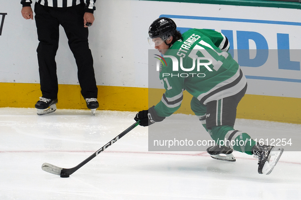 Antonio Stranges #71 of the Dallas Stars skates up the ice while controlling the puck during the NHL preseason match between the Dallas Star...