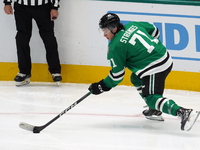 Antonio Stranges #71 of the Dallas Stars skates up the ice while controlling the puck during the NHL preseason match between the Dallas Star...