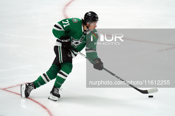 Antonio Stranges #71 of the Dallas Stars skates up the ice while controlling the puck during the NHL preseason match between the Dallas Star...