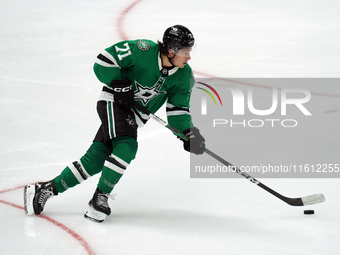 Antonio Stranges #71 of the Dallas Stars skates up the ice while controlling the puck during the NHL preseason match between the Dallas Star...