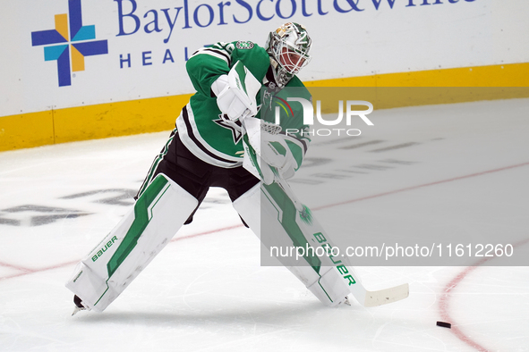 Jake Oettinger #29 of the Dallas Stars stands in the net against Minnesota during the NHL preseason match between the Dallas Stars and the M...