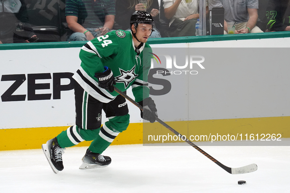 Roope Hintz #24 of the Dallas Stars skates up ice while controlling the puck during the NHL preseason match between the Dallas Stars and the...