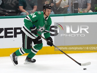 Roope Hintz #24 of the Dallas Stars skates up ice while controlling the puck during the NHL preseason match between the Dallas Stars and the...