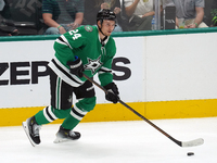 Roope Hintz #24 of the Dallas Stars skates up ice while controlling the puck during the NHL preseason match between the Dallas Stars and the...