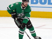 Miro Heiskanen #4 of the Dallas Stars skates up the ice while controlling the puck during the NHL preseason match between the Dallas Stars a...