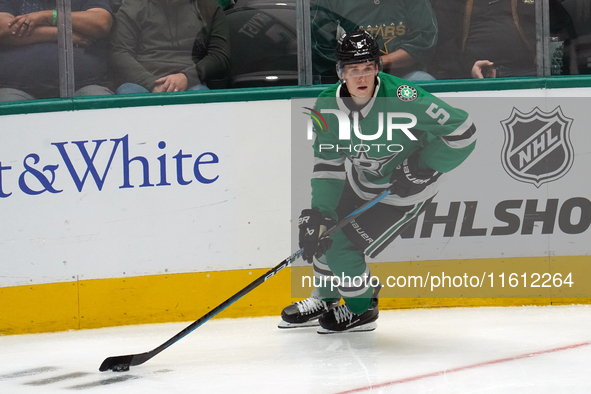 Nils Lundkvist #5 of the Dallas Stars skates up the ice while controlling the puck during the NHL preseason match between the Dallas Stars a...