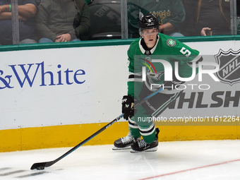 Nils Lundkvist #5 of the Dallas Stars skates up the ice while controlling the puck during the NHL preseason match between the Dallas Stars a...