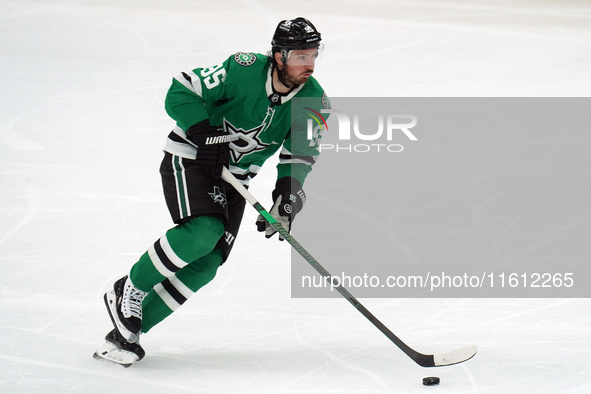 Matt Duchene #95 of the Dallas Stars skates up the ice while controlling the puck during the NHL preseason match between the Dallas Stars an...